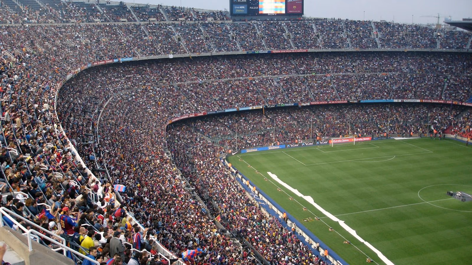 A large football stadium packed with fans before kickoff