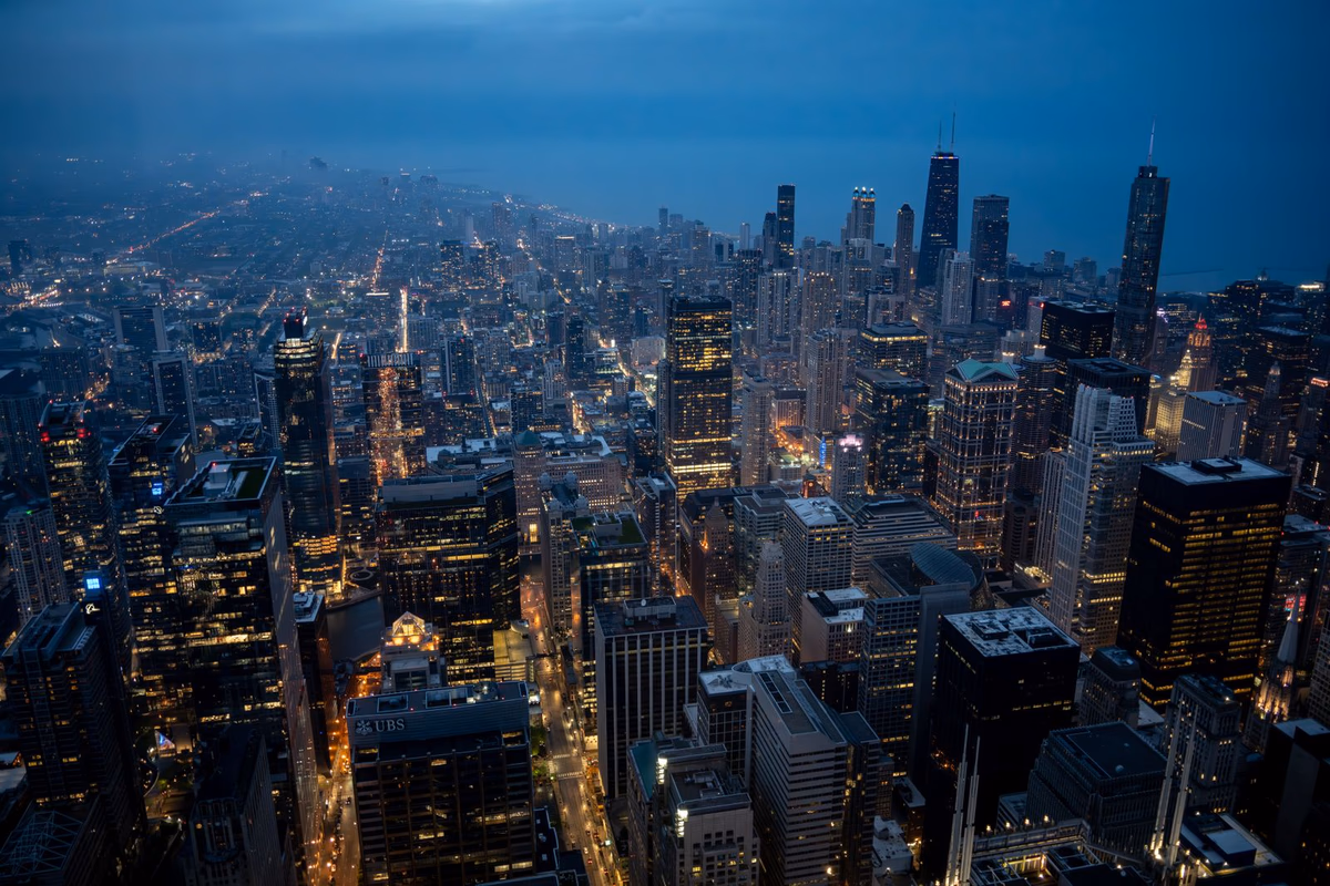 Aerial view of a large North American city skyline at dusk